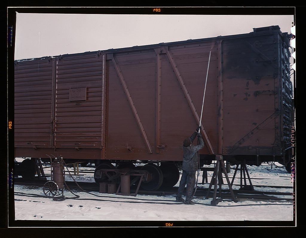 Painting a car at the repair or 'rip' tracks at North Proviso, C & NW RR., Chicago, Ill.jpg