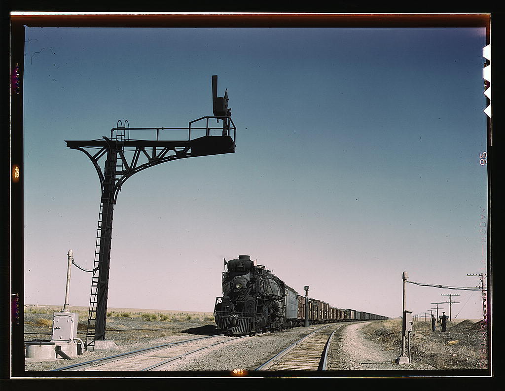 West bound Santa Fe R.R. freight train waiting in a siding to meet an east bound train, Ricardo, New Mexico.jpg