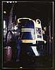 Washing one of the Santa Fe R.R. 54 hundred horse power diesel freight locomotives in the roundhouse, Argentine, Kansas.jpg
