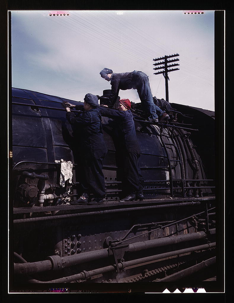 C & NW. RR., women wipers employed at the roundhouse cleaning one of the H class locomotives, Clinton, Iowa.1943.jpg