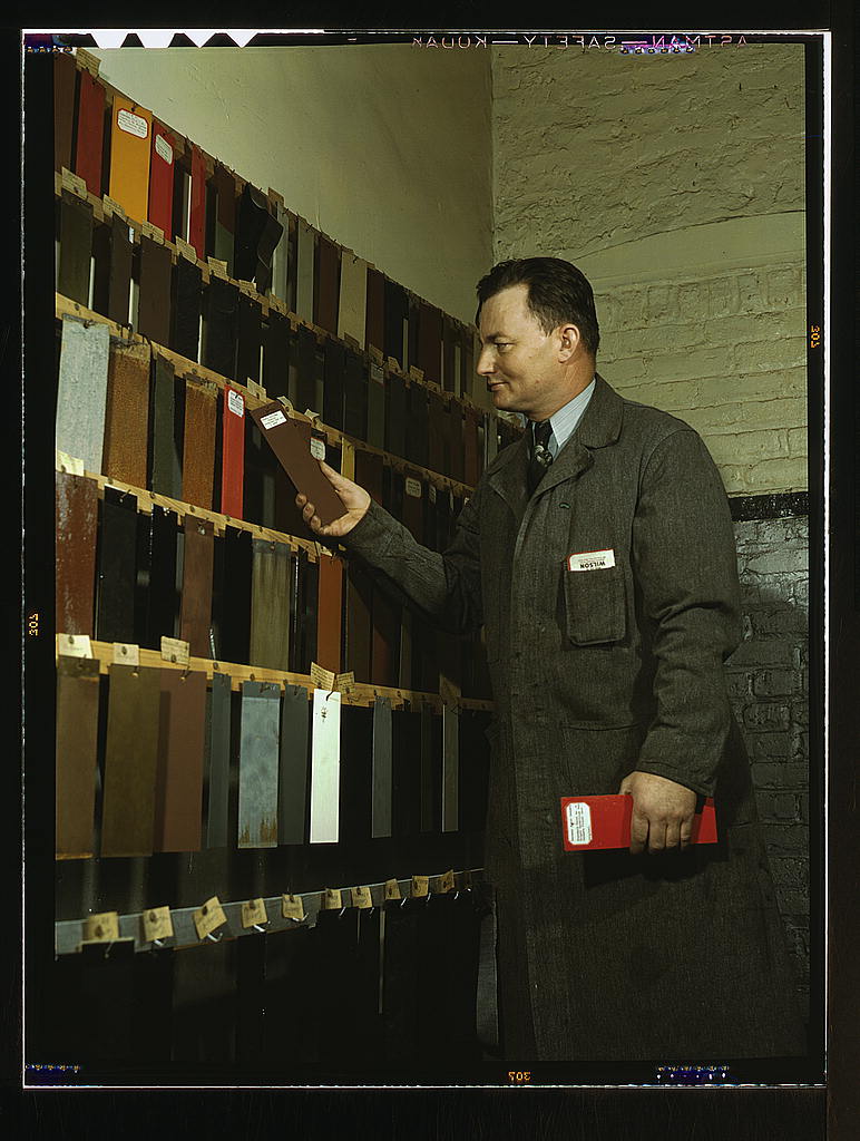 Laboratory worker at the research laboratory at the C & NW RR's 40th street yard, examining paint samples used on cars of the railroad, Chicago, Ill. 1942.jpg