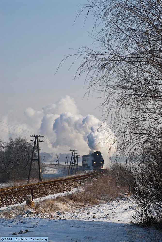 2012-02-05 10.55 Ol49-59 at level crossing no. 58 with Wolsztyn-bound train.jpg