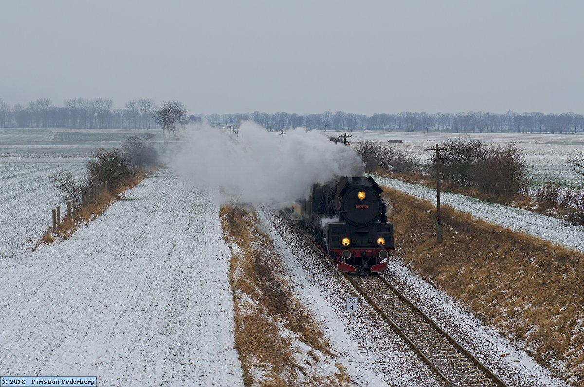 2012-02-07 14.40 Ol49-59 near Granowo with Poznan-bound train.jpg